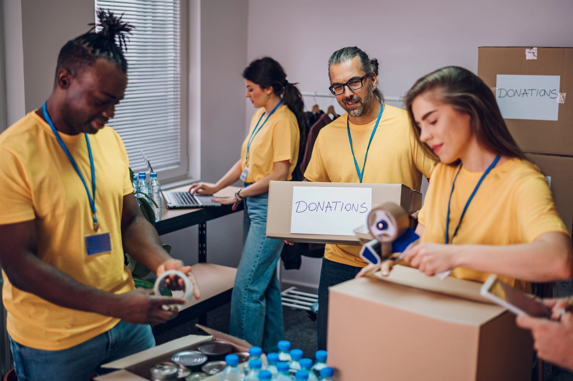 Group of multiracial volunteers working in community charity donation center